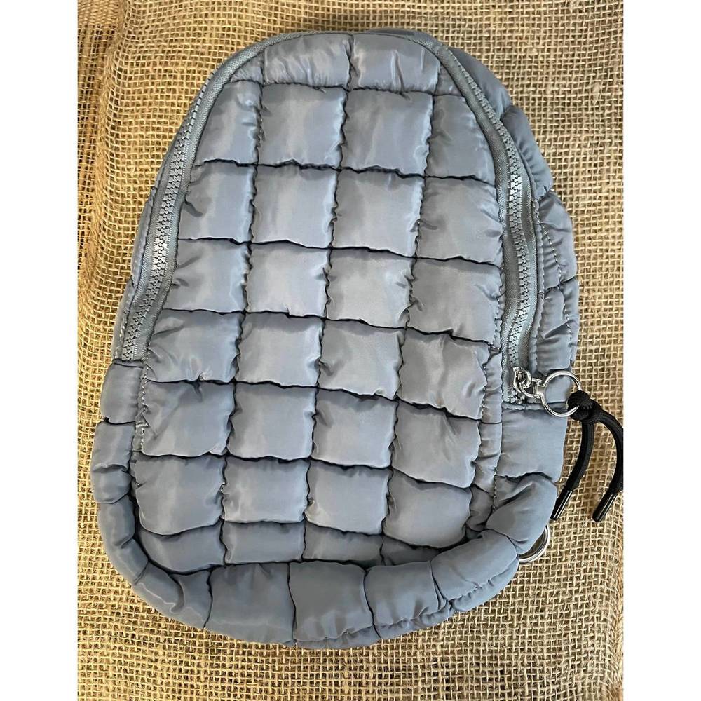 NEW WALL TO WALL puffer sling bags in blue